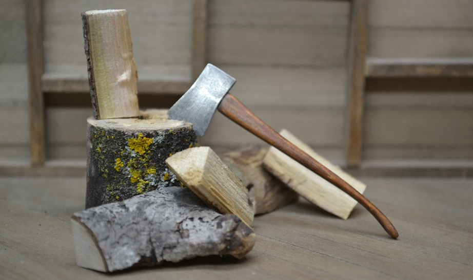 hatchet in woodpile